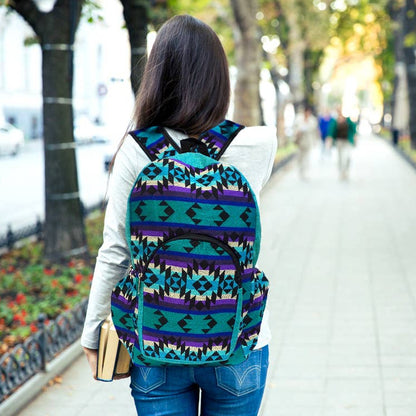Person walking on a sidewalk with a colorful patterned backpack