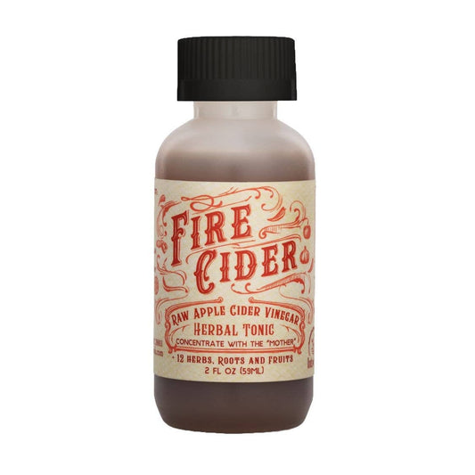 Fire Cider raw apple cider vinegar herbal tonic concentrate with the mother with 12 herbs, roots and fruits. 2 oz. bottle for good health.  on a white background.