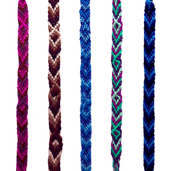Five braided bracelets of different colors on a white background