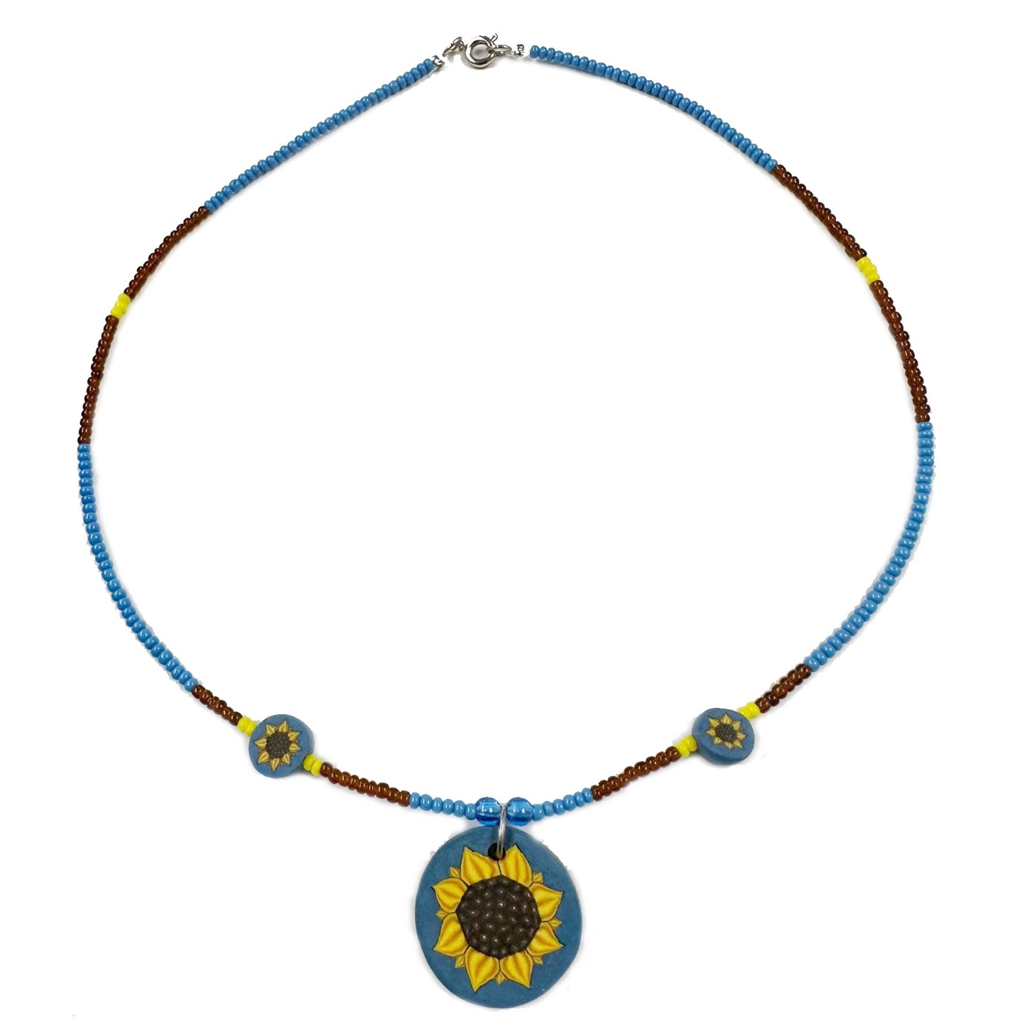 Necklace with sunflower pendant on a white background