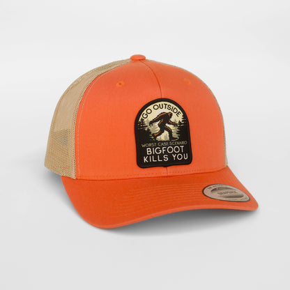 Orange and beige cap with a Bigfoot graphic and text on a white background
