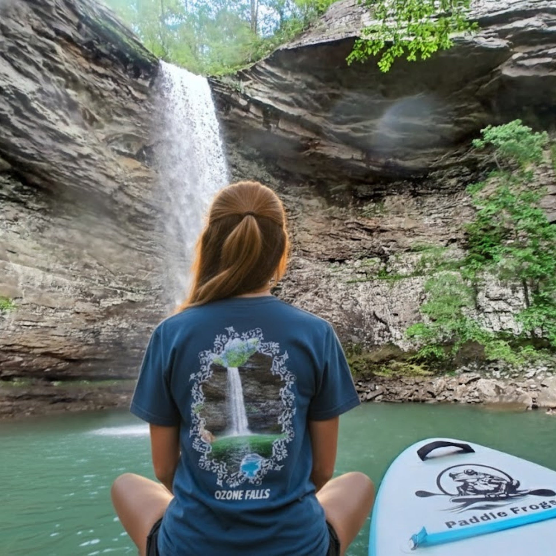 lady sitting crisscross applesauce at Ozone Falls | Plunge Waterfall Tee Paddle Frogs