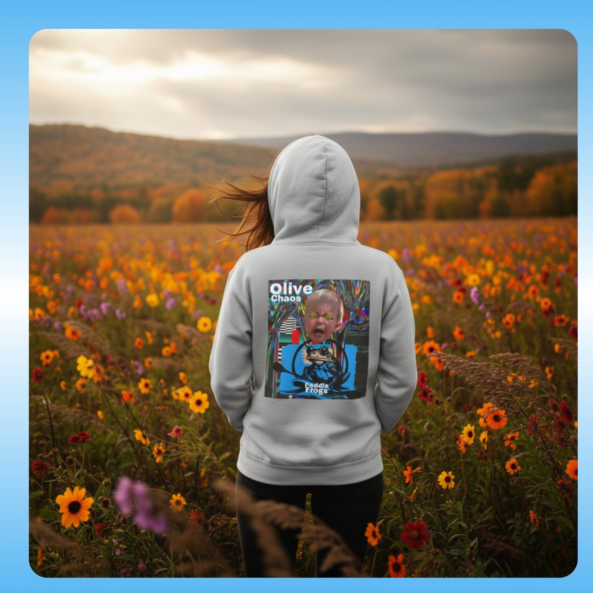 olive Chaos Cement Grey Paddle Frogs Outdoor Gear Hoodie pull over coat Person wearing a hoodie with a graphic design in a field of flowers