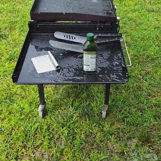 Grilling outside in the rain. Paddle Frogs in Harriman, TN events and Saturday Fun Days at 5pm. Games, sports, paddleboarding, where good people gather to be outside, shop, and have a blast in East Tennessee.