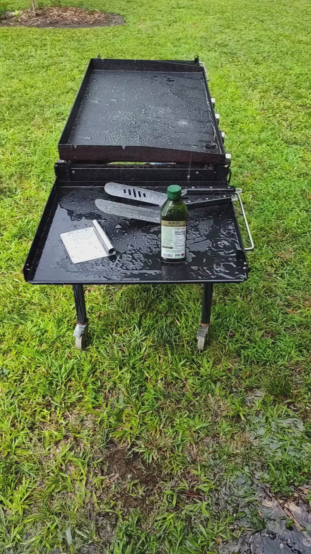 Grilling outside in the rain. Paddle Frogs in Harriman, TN events and Saturday Fun Days at 5pm. Games, sports, paddleboarding, where good people gather to be outside, shop, and have a blast in East Tennessee.