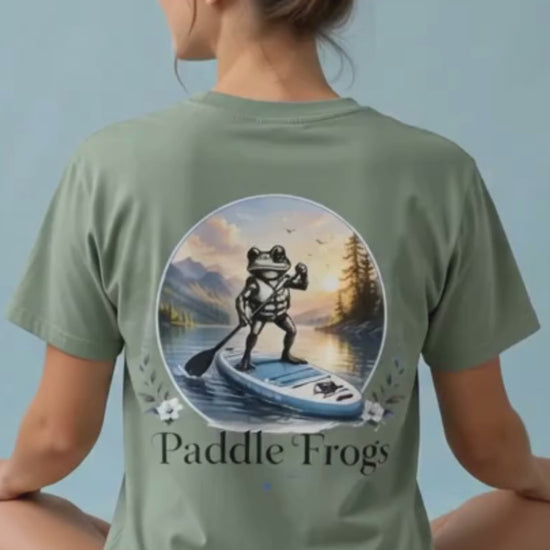 A lady modeling the Paddle Frogs™ Sage cotton paddleboarding tee letting every woman know that it is super soft and comfortable.