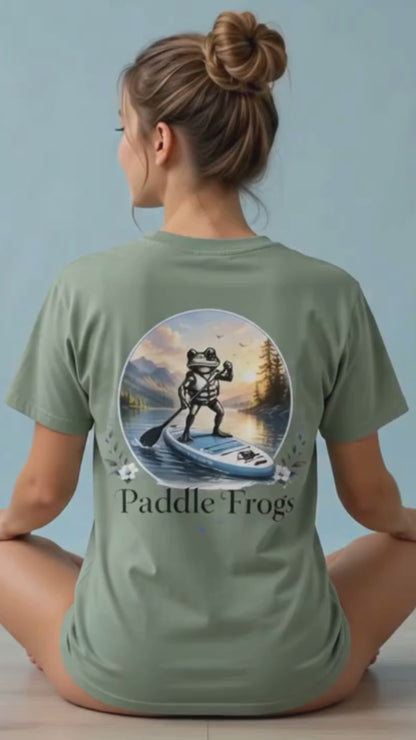 A lady modeling the Paddle Frogs™ Sage cotton paddleboarding tee letting every woman know that it is super soft and comfortable.