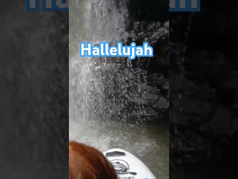 Hallelujah enjoying nature paddle boarding in waterfalls