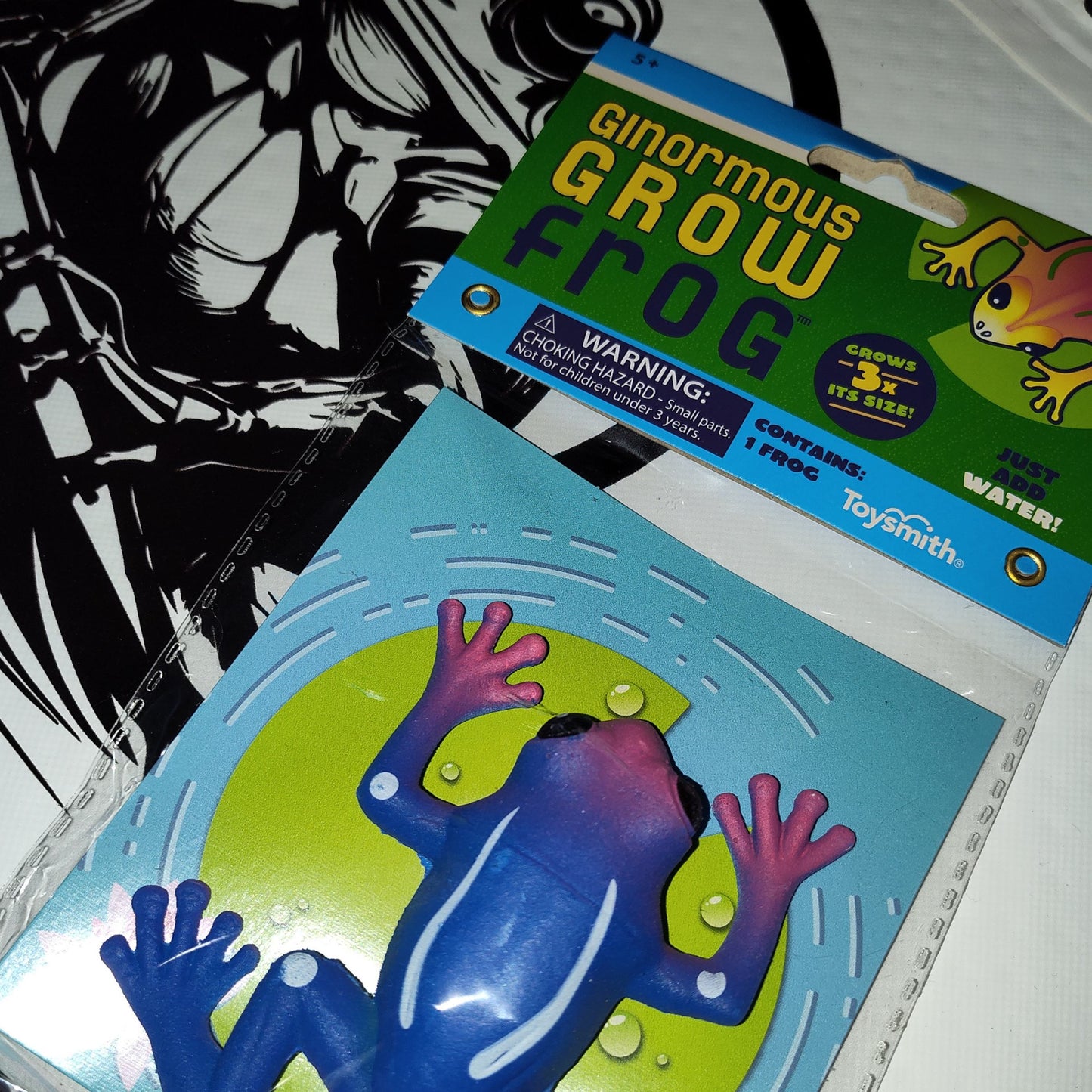 Ginormous Grow Frog toy packaging with warning label on a white background