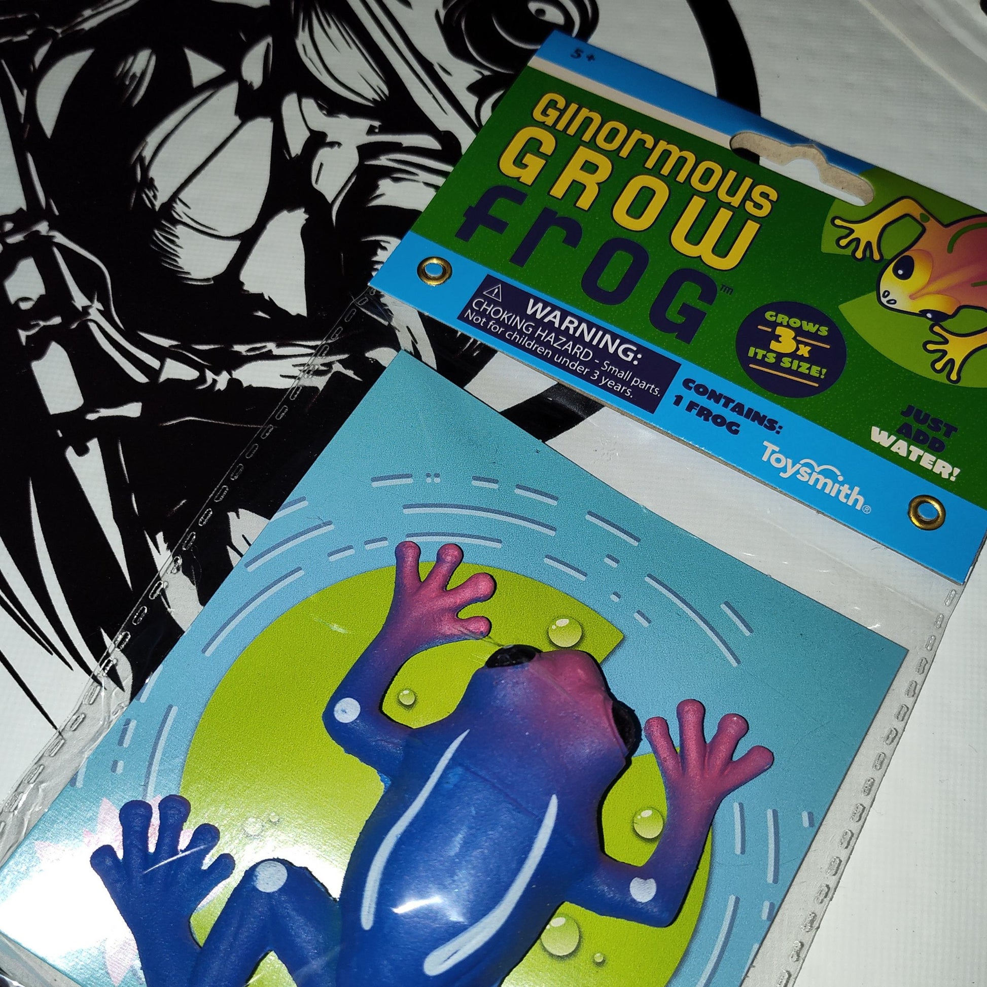 Ginormous Grow Frog toy packaging with warning label on a white background