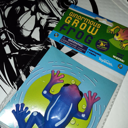 Ginormous Grow Frog toy packaging with warning label on a white background