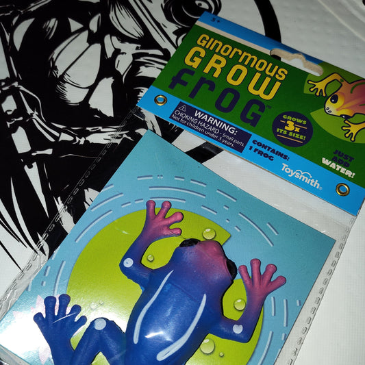 Ginormous Grow Frog toy packaging with warning label on a white background