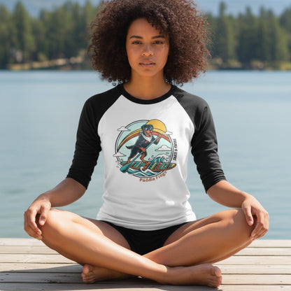 sitting crisscross applesauce at the lake boat dock wearing Rottweiler Paddleboarding tee by Paddle Frogs