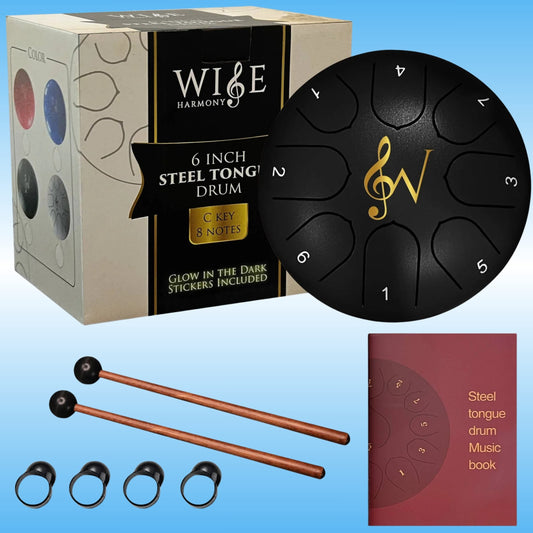A 6-inch steel tongue drum set with its packaging box, two copper mallets, four black finger tips, and a music book on a blue gradient background. The brand 'Wise Harmony' is clearly visible on the box.